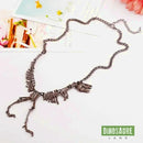 collier pendentif dinosaure noir