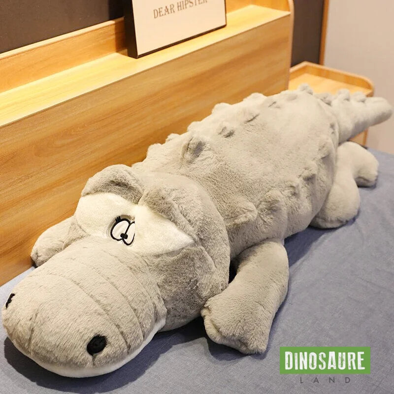 grande peluche dinosaure gris