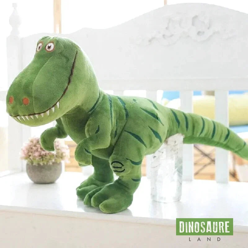 dinosaure en peluche vert